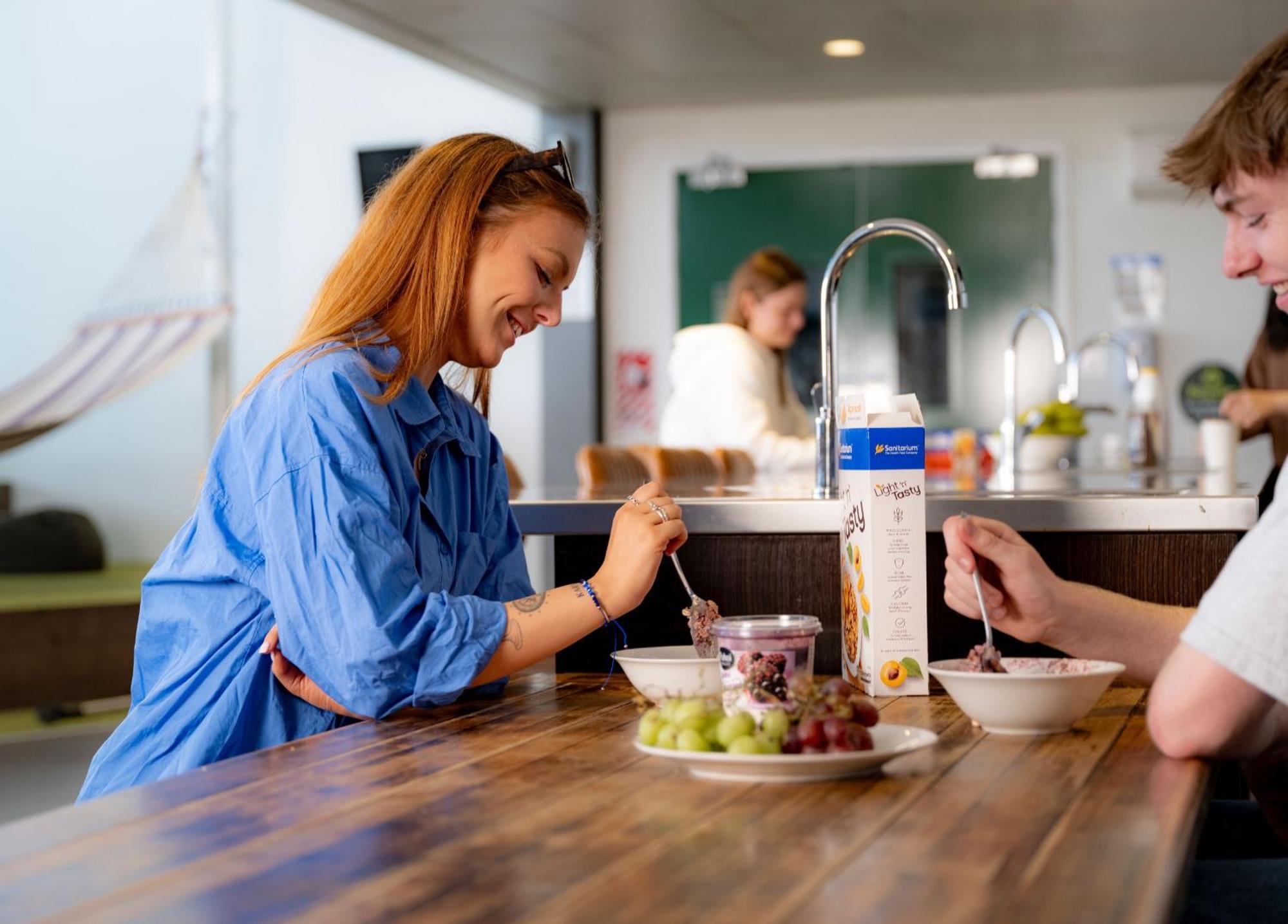 Lylo Christchurch Exteriör bild A woman eating muesli